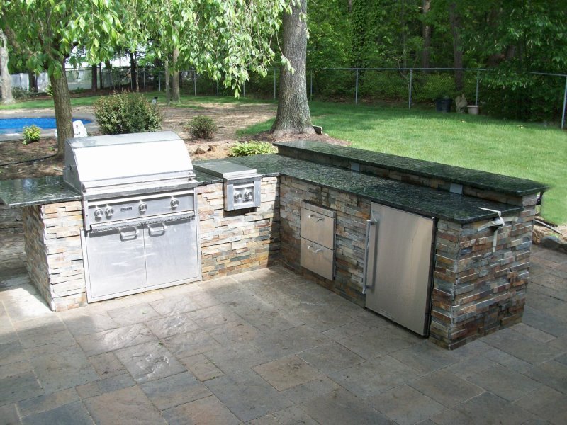 backyard kitchen island with granite counter top